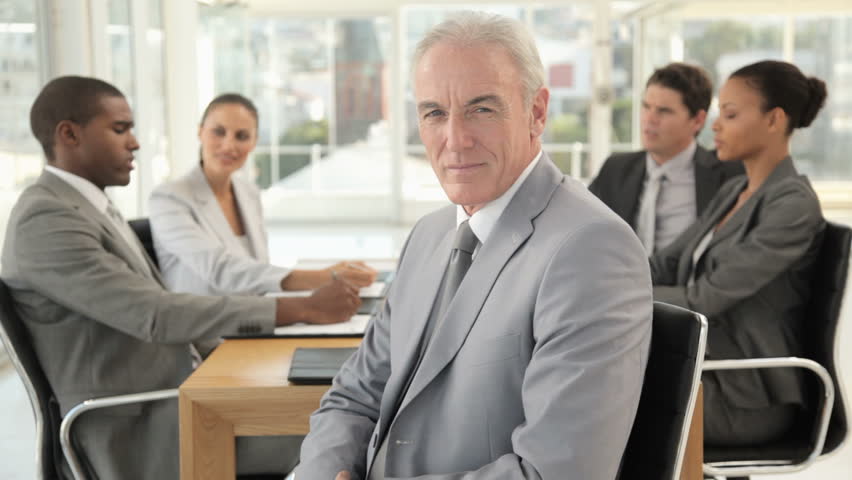 Businessman Posing at a Meeting