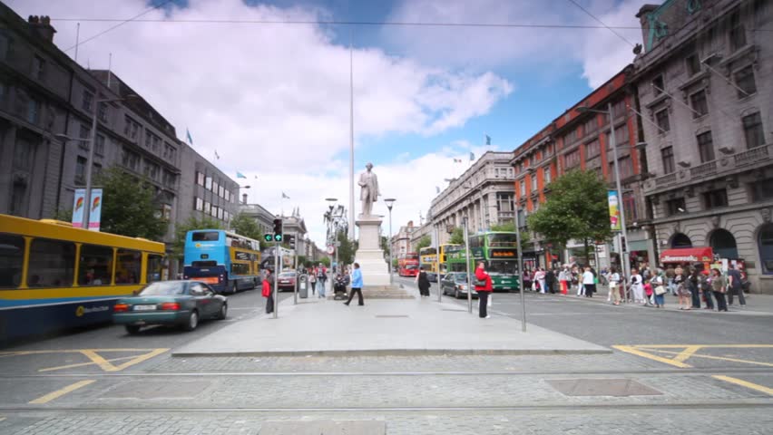 DUBLIN - JUNE 6: People and vehicle traffic on very wide O'Connell Street on June 6, 2010 in Dublin, Ireland. O'Connell Street is Dublin's main thoroughfare and one of Europe's widest streets. 