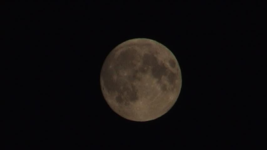 Silhouettes of migrating Canada Goose on moon, tripod, 16x9