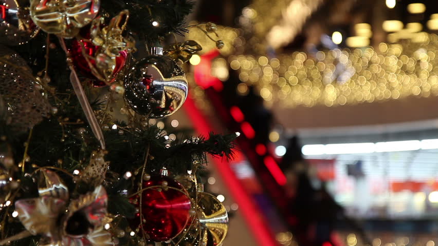 Consumer on escalators in shopping mall at christmas time