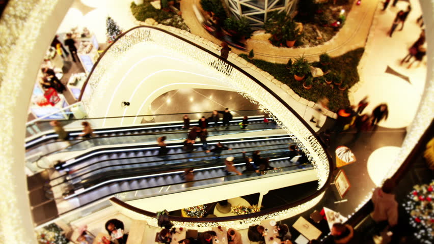 Consumer on 2 escalators in shopping mall  - Time lapse
