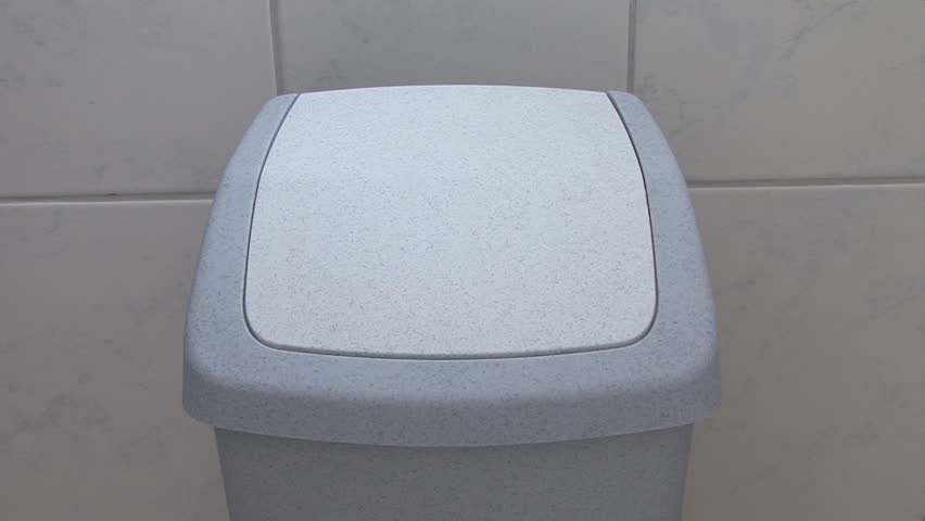 throwing trash in a disposal