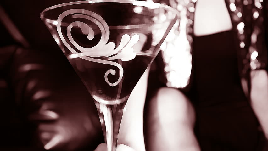 beautiful classic pinup girl in a VIP club drinking a cocktail