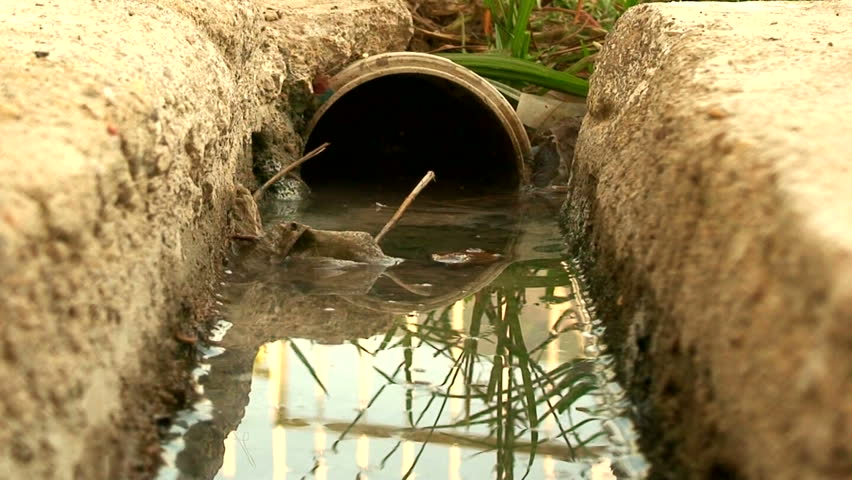 Water flowing down a storm drain 