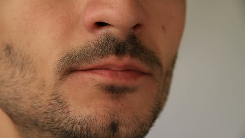 man with stubble eats jabugo serrano ham