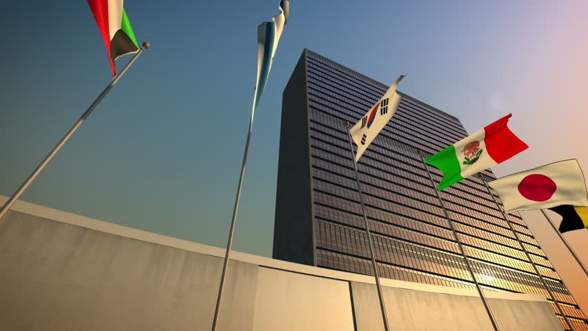 1080p stock video of the United Nations Building and flags against the sky with camera panning by slowly
