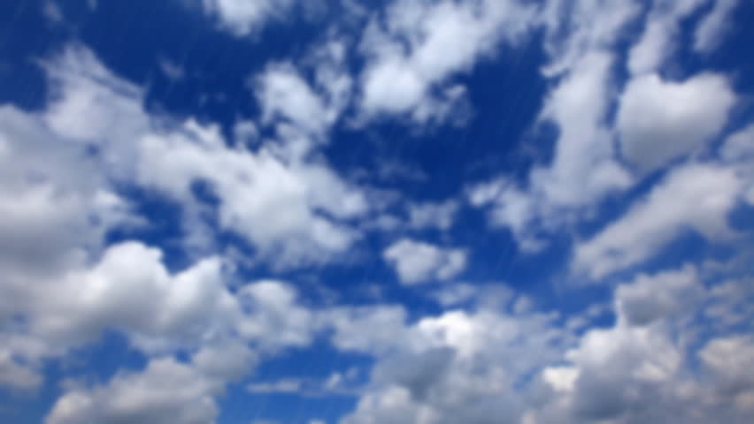 drops of rain on glass - on a background blue cloudy sky