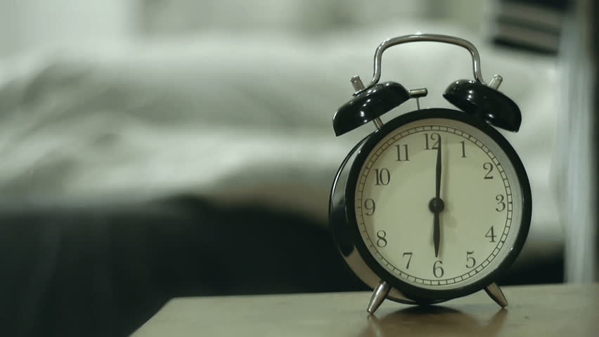 Woman And Dog Waking Up By Alarm Clock At 6 O'clock In The Morning