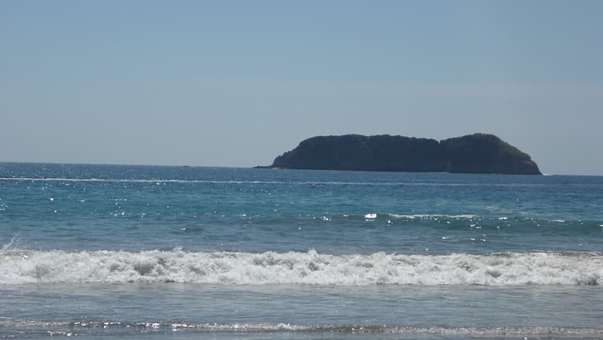 Playa Manuel Antonio Stock Video Footage 4k And Hd Clips Looking Out Into The Ocean At Playa Espadilla In Costa Rica With Island Rock Outcroppings