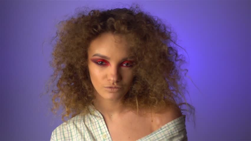 Beautiful Young Girl With Fluffy Curly Hair And Colourful Makeup In