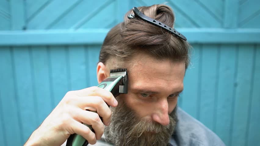Hd00 12strange Hipster Man With Big Gray Haired Beard Trying To Cut