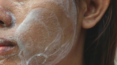 Asian Walking Naked Beach - Close up asia woman cheek. woman washing face (have wide pores) with white  foam by her hand.