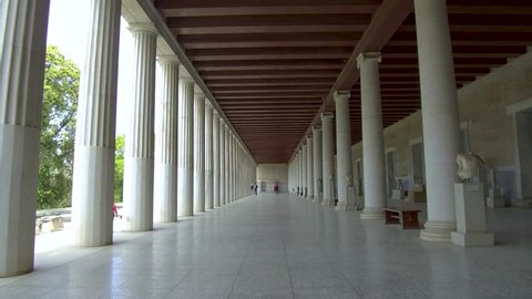 Tracking shot camera moves slowly forward in the interior length of Stoa of Attalos in Athens