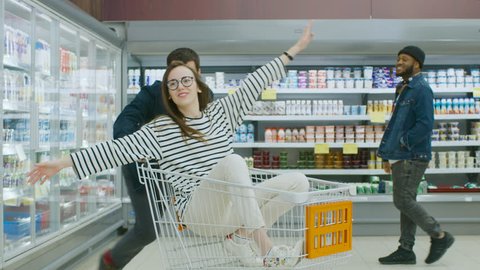 Supermarket Man Pushes Shopping Cart Woman Stock Footage Video (100%  Royalty-free) 1015805035 | Shutterstock