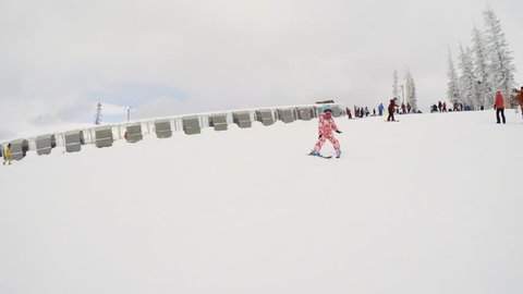 Denver, Colorado, USA-December 1, 2018 - Little girl learning how to ski in alpine mountains.