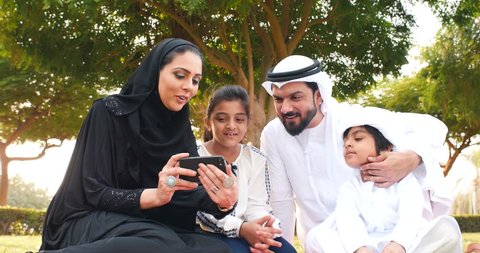 Muslim Schoolgirl Porn - Happy muslim family spending weekend time at the park in dubai