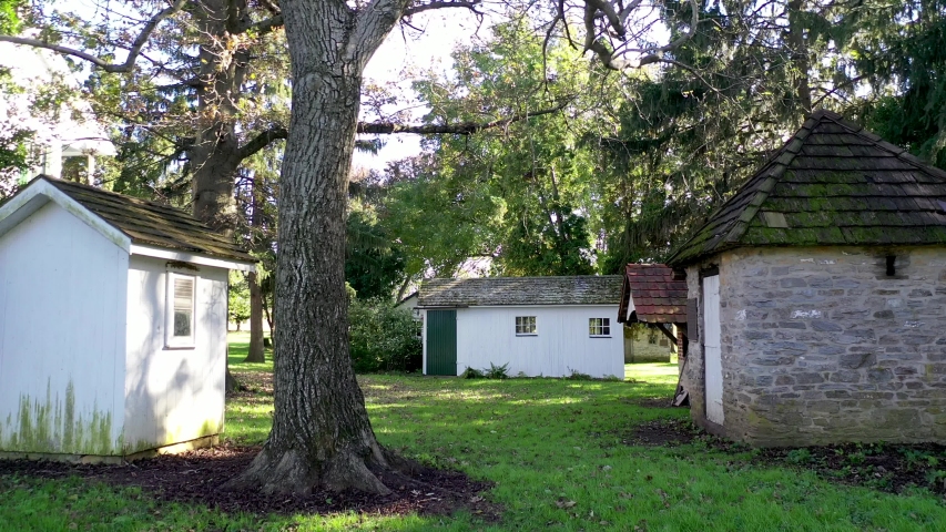 Aerial Slow Flypast Outbuildings To Building With A Green Door Herr
