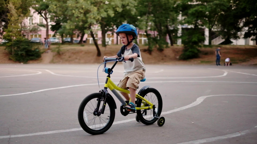 Hd00 12child Riding Bicycle In Park At Sunset Light Kid In Helmet