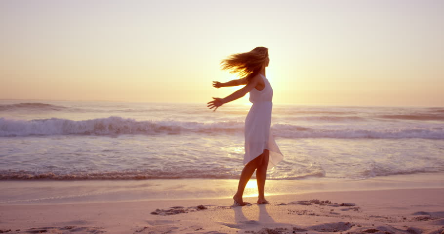 Free Happy Woman Arms Outstretched Enjoying Nature On Beach At Sunset ...