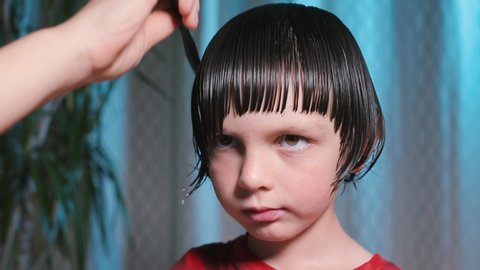 Close Up Of Hair Cutting On The Boy S Head Wet Hair Is Cut In A Straight Line Baby Haircut