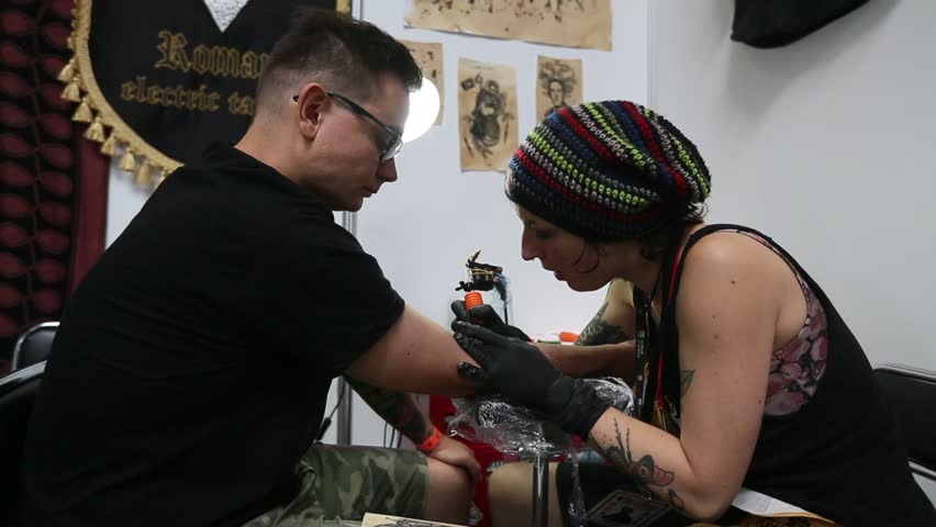 krakow poland june 6 2015 people make a tattoos at the 10 th krakow poland june 6 2015 people make a tattoos at the 10 th