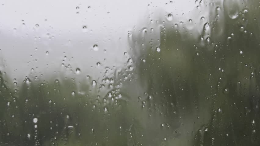 Raindrops Running Down A Window During A Thunderstorm Stock Footage ...