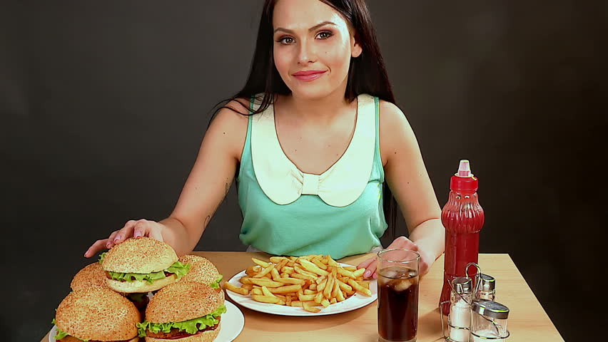 Woman Eating Fast FoodSlim Girl Absorbs Hug