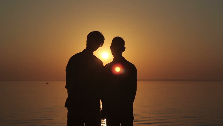 happy gay couple on beach happy gay couple on beach