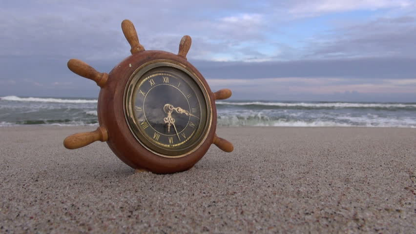 Ship Steering Wheel Like Clock Stock Footage Video 100 Royalty Ship Steering Wheel Like Clock On The Beach In Sand