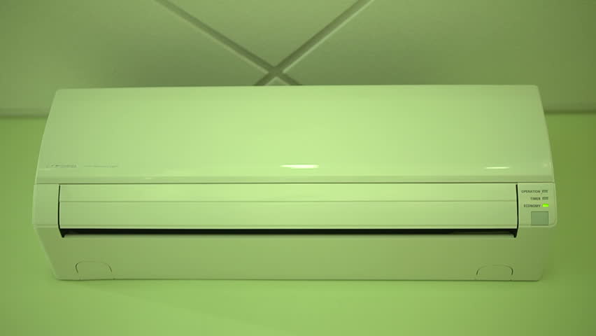 Start The Air Conditioner In Stock Footage 100 Royalty Free Start The Air Conditioner In Office And Remote Control Hot Summer Weather Isolated On Green Background
