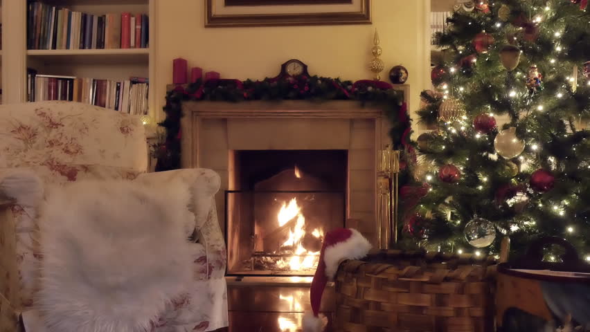 christmas tree next to fireplace