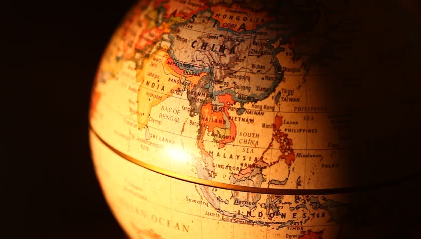 Vintage Rotating Globe And Map Of The World With Magnifying Glass ...