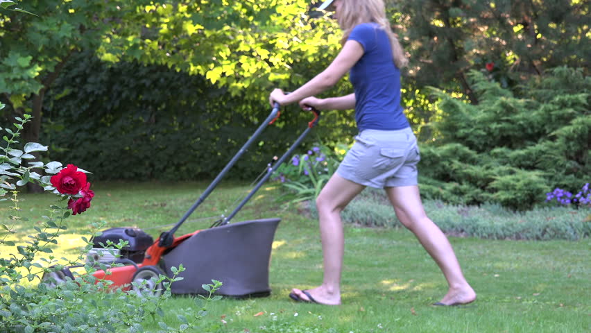 Beautiful Barefoot Woman In Dress And Hat Mowing Lawn Grass In ...