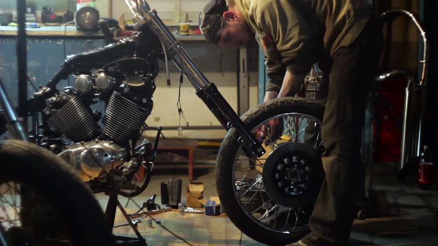 Auto Mechanic Assembles Custom Motorcycle Stock Videoer 100