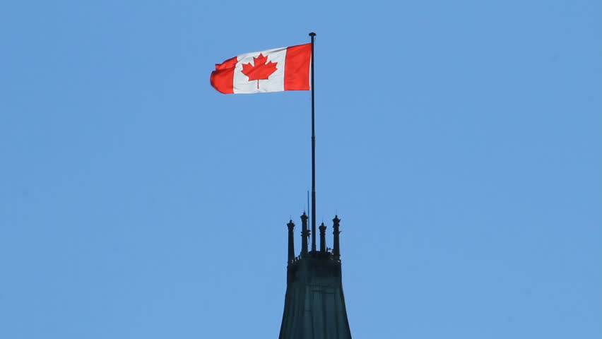 The Canadian Flag Atop The Peace Tower On Parliament Hill. Stock ...