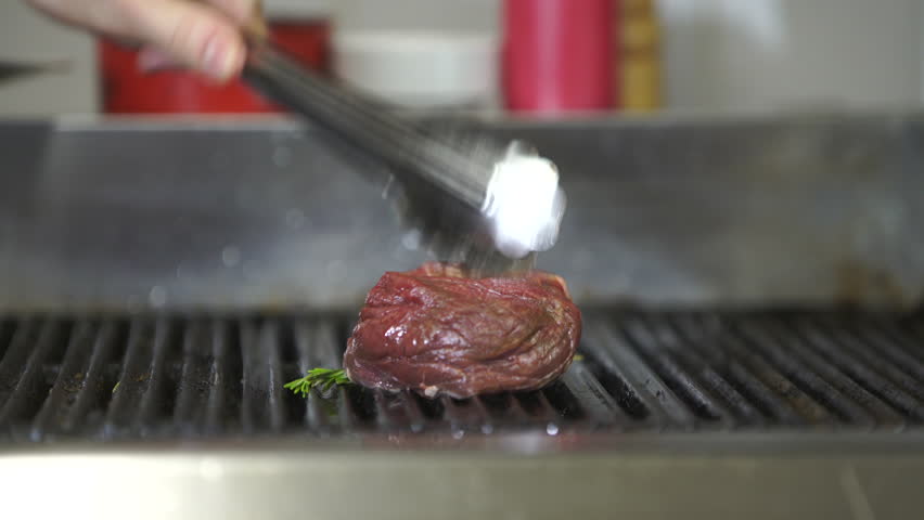 Restaurant Kitchen Video beef steak is grilling at restaurant kitchen stock footage video Restaurant Kitchen Video beef steak is grilling at restaurant kitchen stock footage video