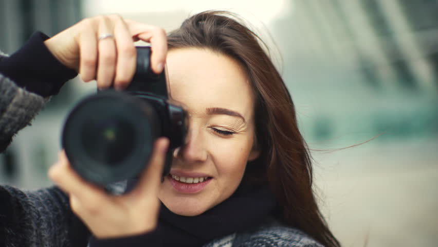 Beautiful Young Female Photographer Taking Pictures , Puts The Focus ...