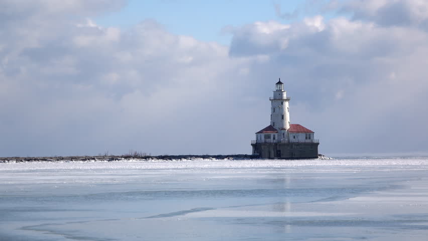 Winter View Of Lighthouse, Waves And Ice Floes On Lake Superior. Stock ...