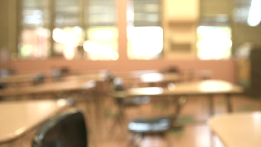 Pan Left Of School Desks In Rows