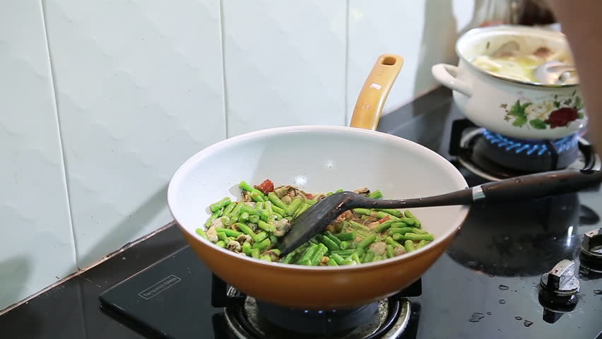 Thai Food Cooking Pour Sugar On Vegetables And Mussel In A Wok Thai Food Cooking Pour Sugar On Vegetables And Mussel In A Wok