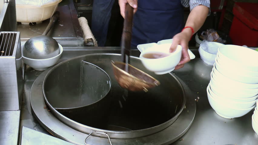 Stock video of chef preparing traditional asian street food | 1826705