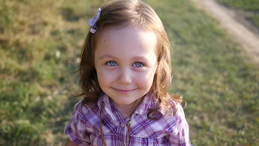 Cute Little Blue Eyes Kid Girl Portrait Stay Posing To Camera Outdoor