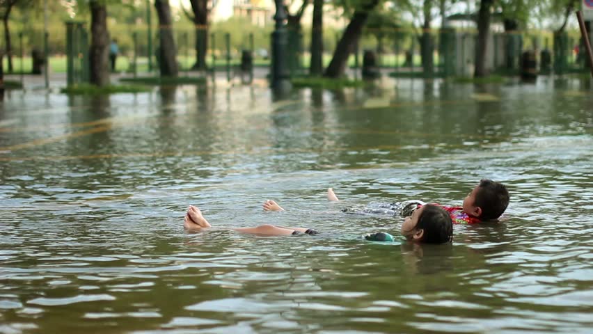 Kids Swimming In A Lake two kids swimming in water in the lake, happy day stock footage Kids Swimming In A Lake two kids swimming in water in the lake, happy day stock footage