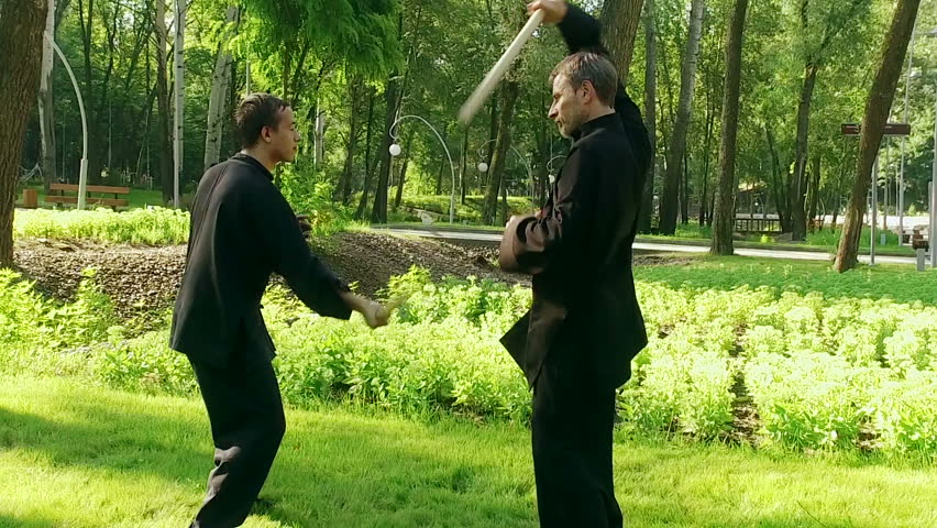Qigong Exercise With A Wooden Stick Two Men Practicing Elements Of Exercise With A Wooden Stick Two Men Practicing Elements Of Qigong Slow Motion Hd