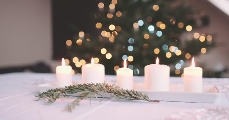 Dinner Table Background candles burning on the table in front of abstract blurred Dinner Table Background candles burning on the table in front of abstract blurred