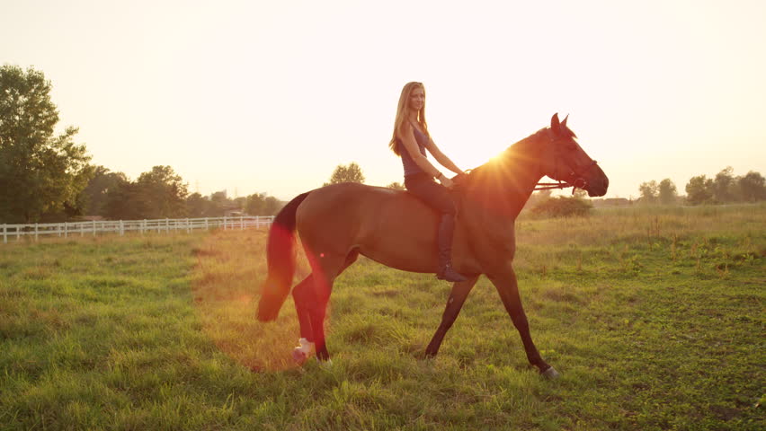 SLOW MOTION, CLOSE UP: Beautiful Young Caucasian Blonde Girl Bareback ...