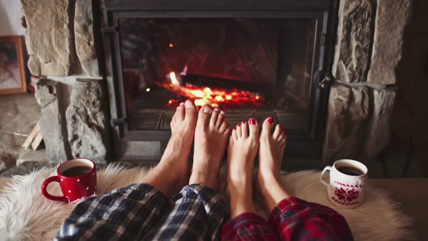 Feet In Woollen Socks By The Burning Christmas Cozy Fireplace. 4K ...