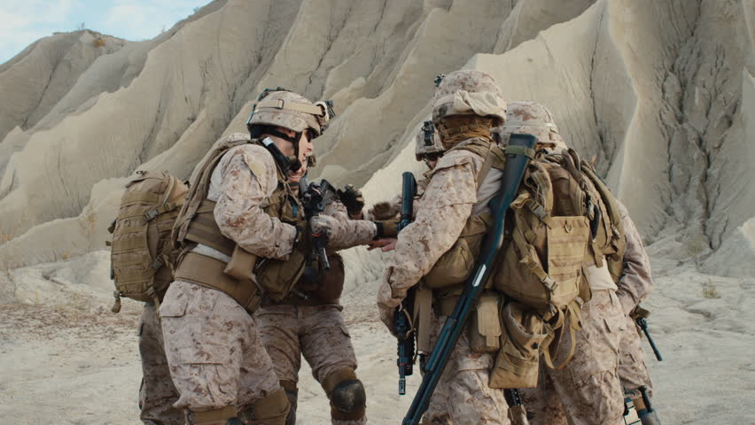 Group Of Soldiers Are Standing In A Circle And Listening Orders From 