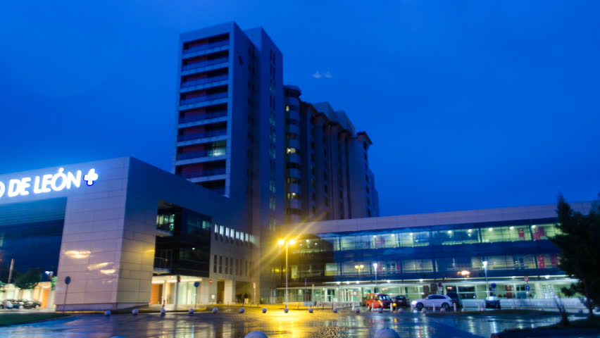 Health Care Modern Hospital Exterior Building At Night. Time Lapse ...