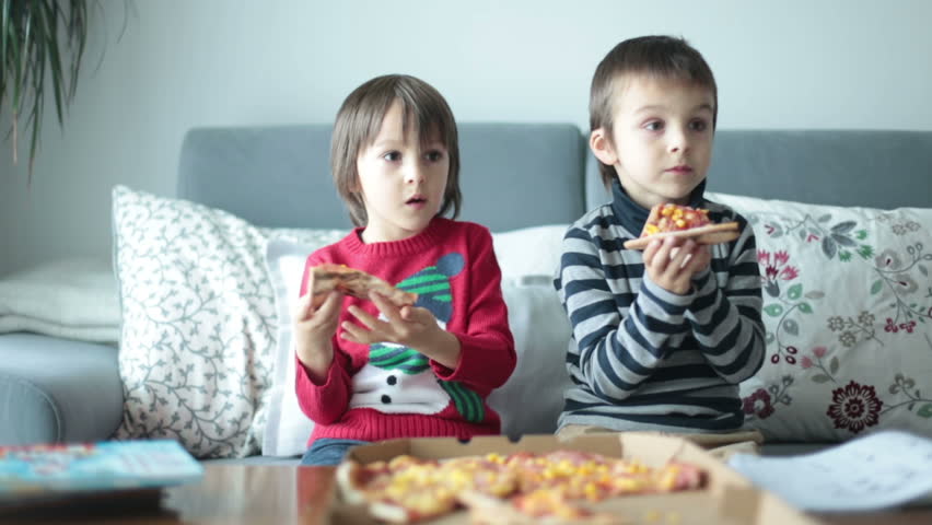 Toddler eating watching tv